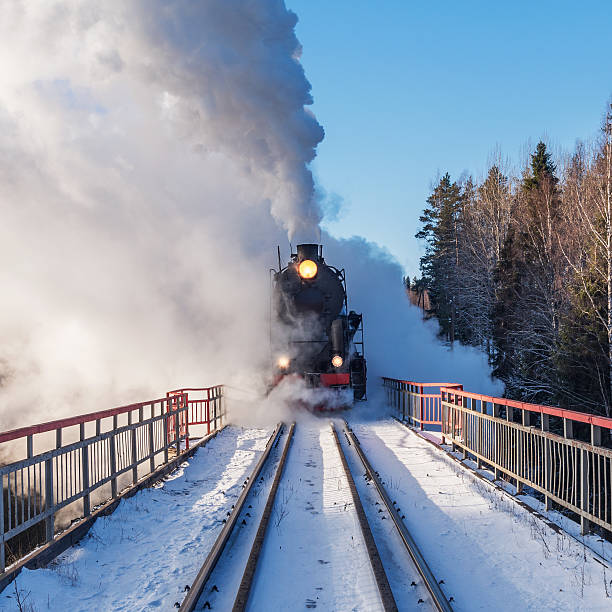 istock Retro steam train arrives at winter. 2214959052