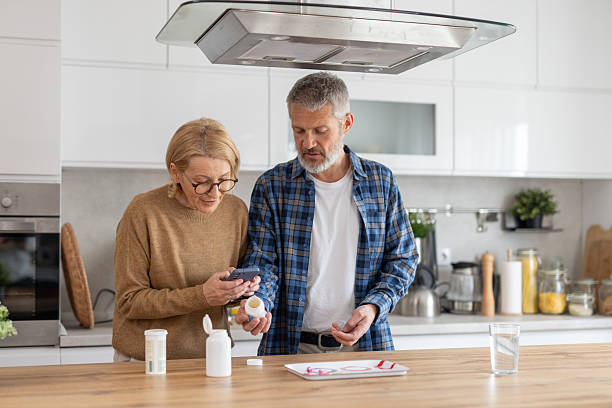 istock Elderly Couple Detailed Consultation About Medication Use 2214959345