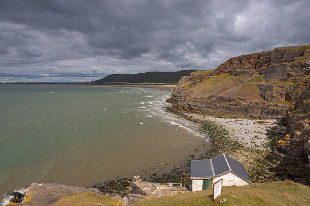 istock Rhossili Bay is an iconic destination with dramatic, panoramic v 2214963672