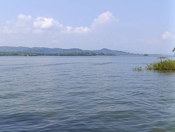 istock Wide expanse of calm water under a blue sky 2214964713