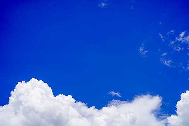 istock sky and white clouds. Beautiful blue sky clouds for background. Blue Sky with Fluffy White Clouds on a Sunny Summer Day. 2214969575