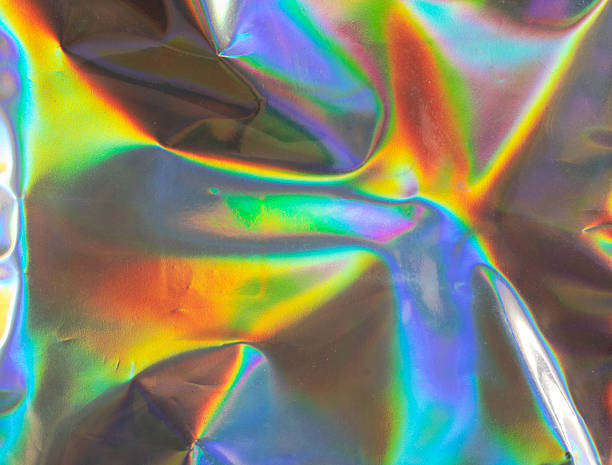 istock hologram surface wrinkled with rainbow texture background 2214970055