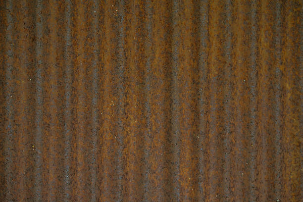 Dark brown zinc surface.grunge texture, textured zinc, rusty surface, grungy background, damaged texture, rusty metal texture, rusted material close-up, stained with rust, vintage wall.