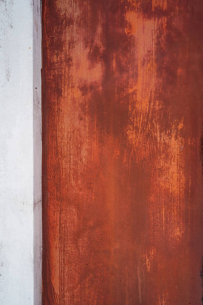 istock Old white and orange-brown painted concrete walls 2214970475