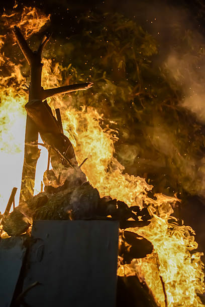 istock Fire flames on black background, Blaze fire flame texture background, Beautifully, the fire is burning, Fire flames with wood and cow dung bonfire 2214971281