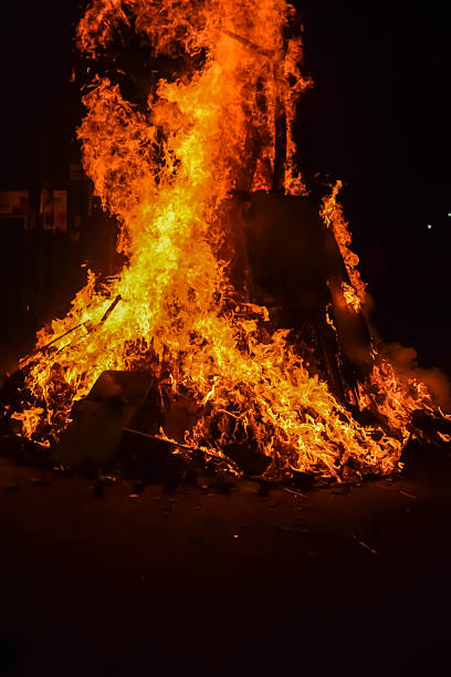 istock Fire flames on black background, Blaze fire flame texture background, Beautifully, the fire is burning, Fire flames with wood and cow dung bonfire 2214971292