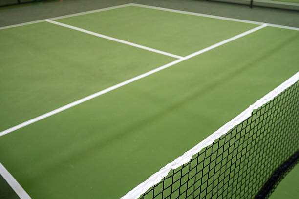 istock A lone pickleball net on a deserted green court 2214973090