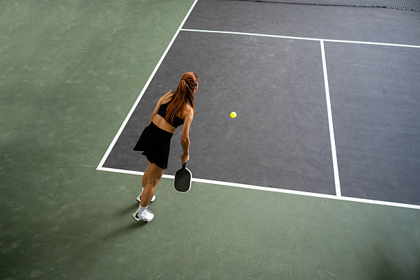 istock Game Begins with Grace: A Powerful Outdoor Serve from a Focused Pickleball Player 2214974026