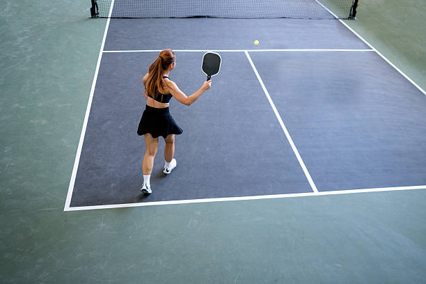 High Above the Action: Capturing the Precision of a Powerful Outdoor Shot stock photo