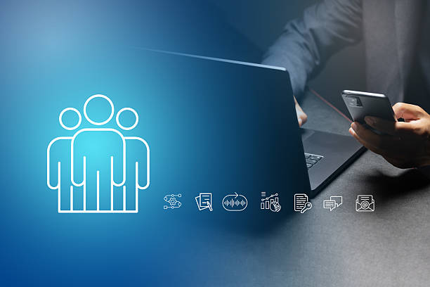 istock A businessman working on laptop with teamwork concept 2214976859