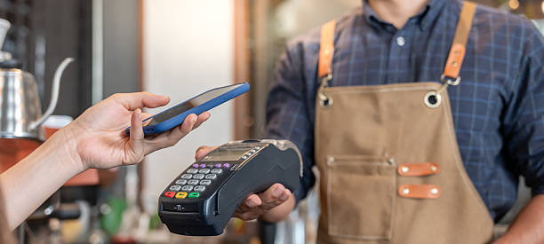 istock Happy Owner receive scan QR code to pay in cafe restaurant with a digital payment without cash. Choose menu and order accumulate discount. E wallet, technology, pay online, credit card, bank app. 2214977901