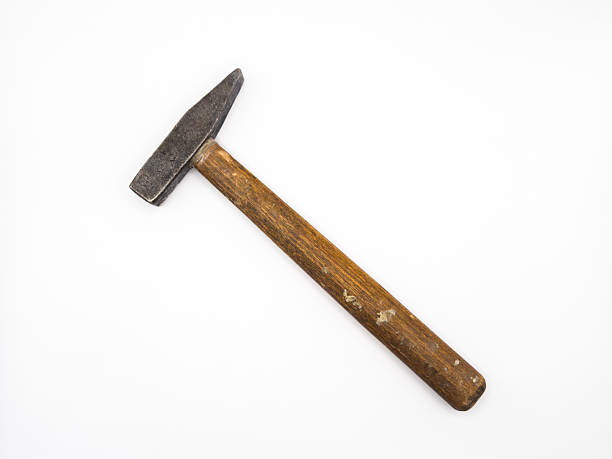 Old hammer with wooden handle isolated on white background. Flat lay. Top view, copy space. High quality photo