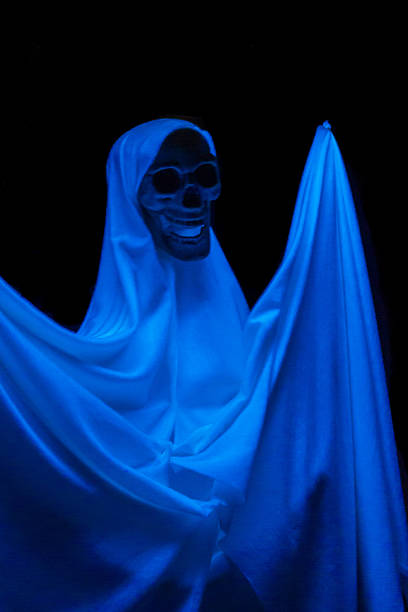istock Dramatic Glow of Skeletal Apparition in an Eerie Dark Environment 2214980468