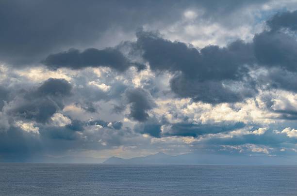 istock A dramatic sky with heavy rainy clouds over the sea 2214981498