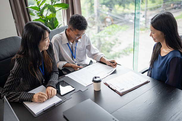 istock Examiner reading a resume during job interview at office Business and human resources concept. 2214982408