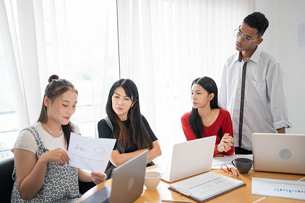 istock Business people group diverse colleagues team discuss project in  bright modern office Startup Diversity Teamwork Brainstorming. 2214982461