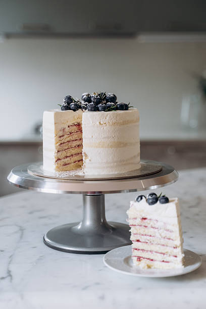 Delicious Layered Cake with Blueberries on Marble Table