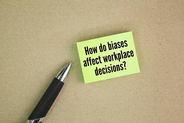 istock Colored pen and paper with question words How do biases affect workplace decisions? 2214983506