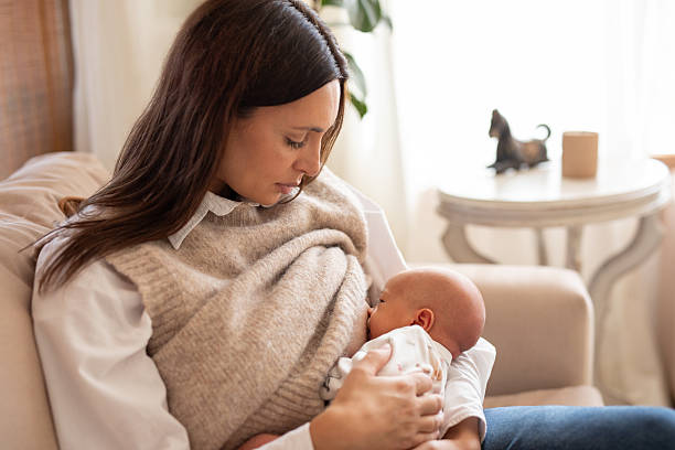 istock Mother breastfeeding her baby at home 2214984508