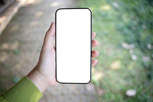 istock Smart phone mockup. Women hands holding cell telephone blank copy space screen smartphone blank white screen isolated technology concept. 2214984749