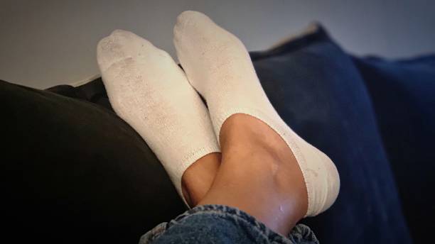 istock Female feet in Socks 2214987346