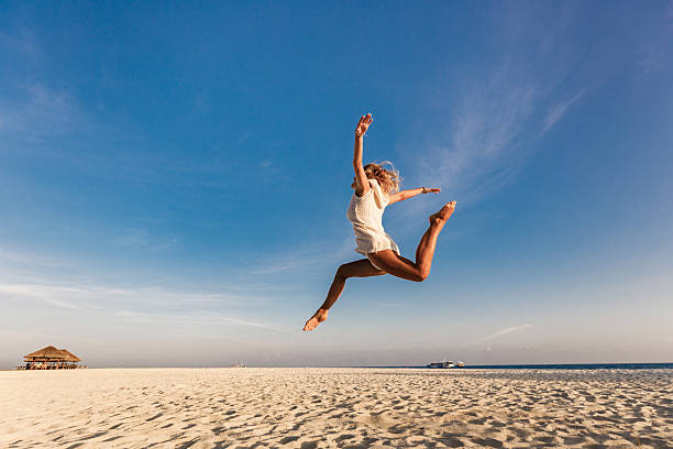 A young woman enjoys peaceful moments in a sunlit field, expressing joy, reflection, and a deep connection with nature. Through varied poses and natural gestures, she embodies freedom, calm, and a sense of harmony with the environment. The scene reflects themes of mindfulness, self-expression, and emotional well-being.