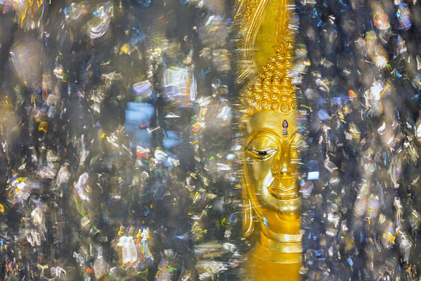 The golden statue of the buddha's face.