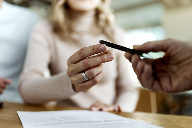 istock Here's a pen for contract signing! 2214989889