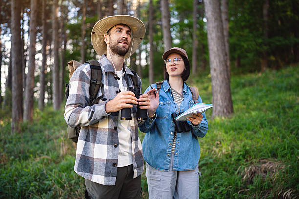 istock Young adventurers birdwatching in a serene forest setting during outdoor hike 2214991466