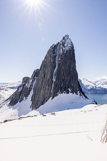istock Snow-Covered Mountain Peak Under Bright Sunlight in Serene Winter Landscape 2214991950