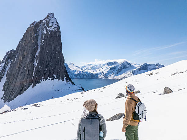istock Hikers Admiring Snowy Mountain Landscape 2214992350