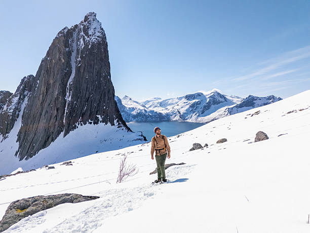istock Hiker Trekking on Snowy Mountain with Scenic View 2214992382