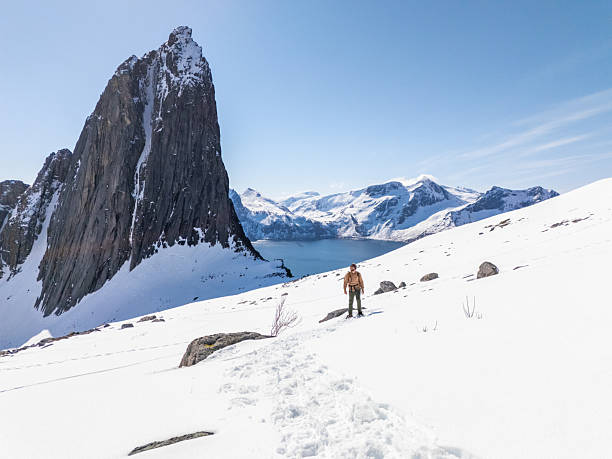 istock Hiker Admiring Snowy Mountain Landscape on a Clear Day 2214992384
