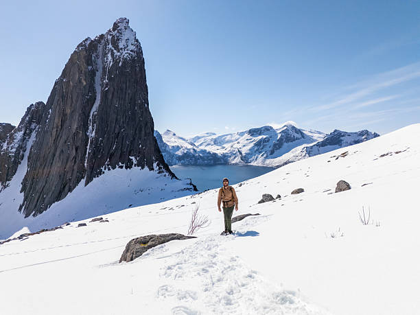 istock Hiker Trekking on Snowy Mountain with Scenic View 2214992398