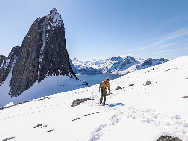 istock Male snowshoeing on bright sunny day in Norway 2214992399