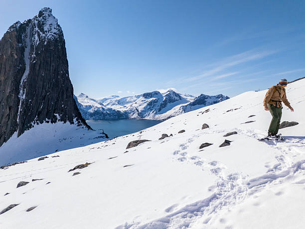 istock Male snowshoeing on bright sunny day in Norway 2214992413