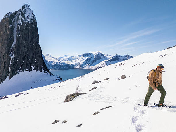 istock Hiker Trekking on Snowy Mountain with Scenic View 2214992440