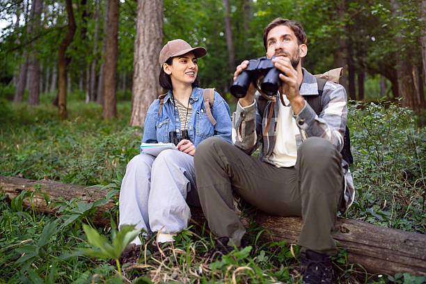 istock Young hikers observing nature and birdwatching in a forest setting 2214995163