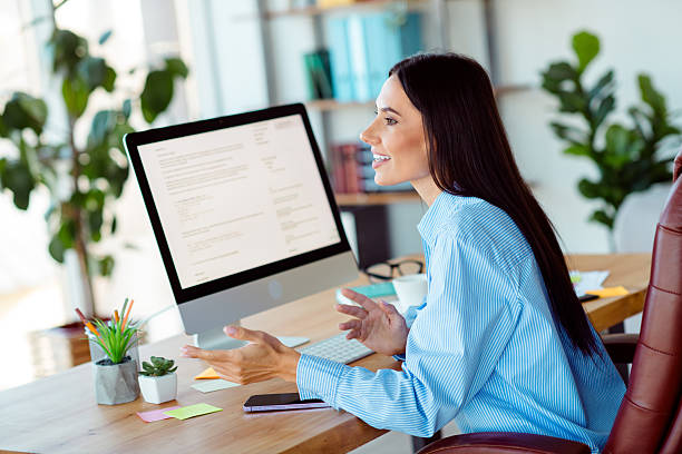 istock Professional young woman engaging in a business discussion inside a modern, light filled office workspace 2214995220