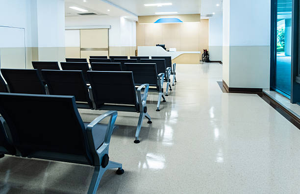 istock Hospital waiting room with many empty chairs 2214999423