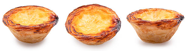 istock Three pastel de nata or traditional Portuguese egg custard tarts on white background. 2215000087