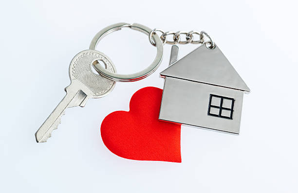 istock House key and red heart shape on white background 2215000462