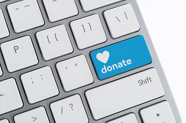 istock Computer keyboard with word donate and heart icon 2215000477