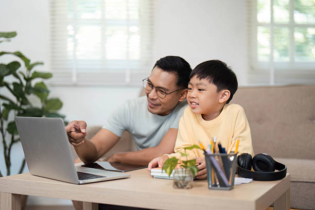 istock Homeschooling fun with father and son learning together 2215000496