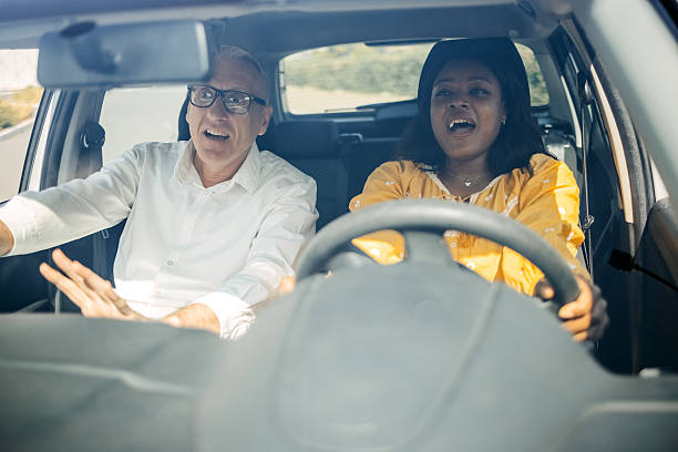 istock Young woman taking driving lessons with her instructor 2215000873