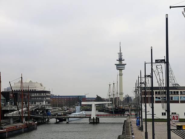 Germany, Bremerhaven  November 23. 2019, 11.16 a.m. inner harbor  with  the Maritime Museum, TV tower, historic sailing ships, a submarine from the Second World War, lanterns and pedestrian bridge