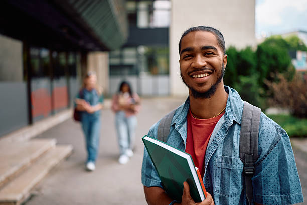 istock Portrait of happy black university student looking at camera. 2215003721