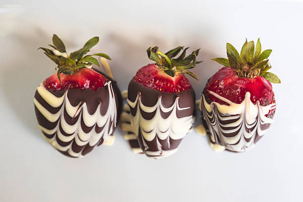 istock Close Up Three Chocolate Covered Strawberries 2215003730