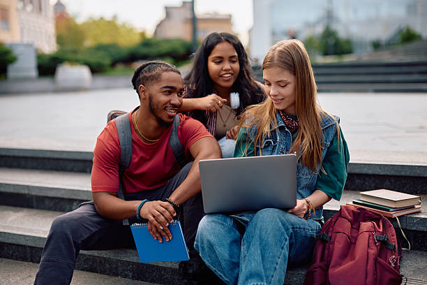 istock Multiracial group of students e-leaning on laptop at university campus. 2215003827