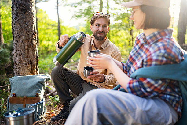 istock Young couple enjoying a peaceful moment outdoors during a forest hike 2215007096
